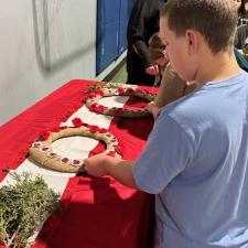 Byron laying  a poppy down